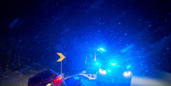 car accident on slippery winter road at night