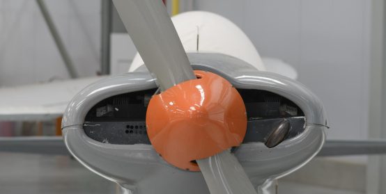 Part of a propeller on light aircraft . Close-up, screws, texture, color surface